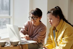 woman-speaking-with-woman-with-down-syndrome